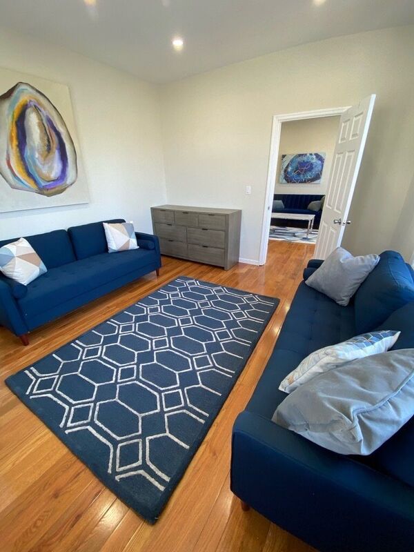 Living room with sectional sofa and patterned rug