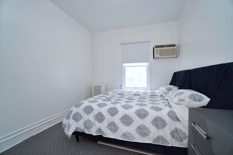 Bedroom with a large bed and window