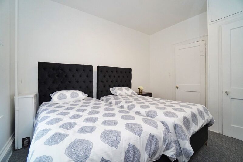 Bedroom with two upholstered beds
